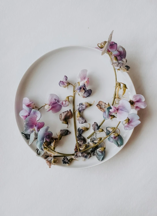 flower arrangement made out of dried pink and white flowers