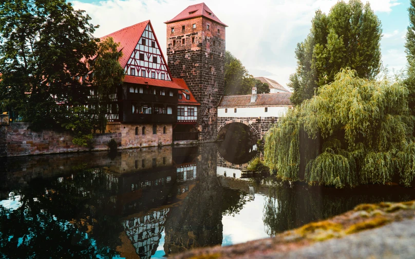 the beautiful building in the river is situated among the trees