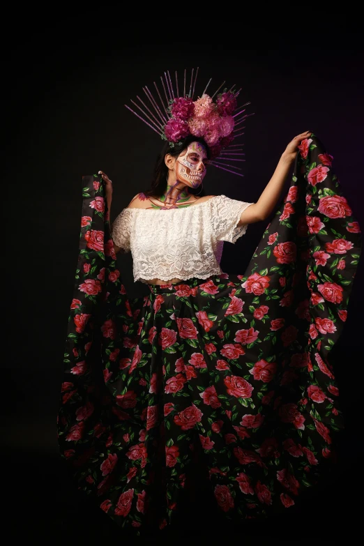 a woman in an unusual dress, veil, and headpiece