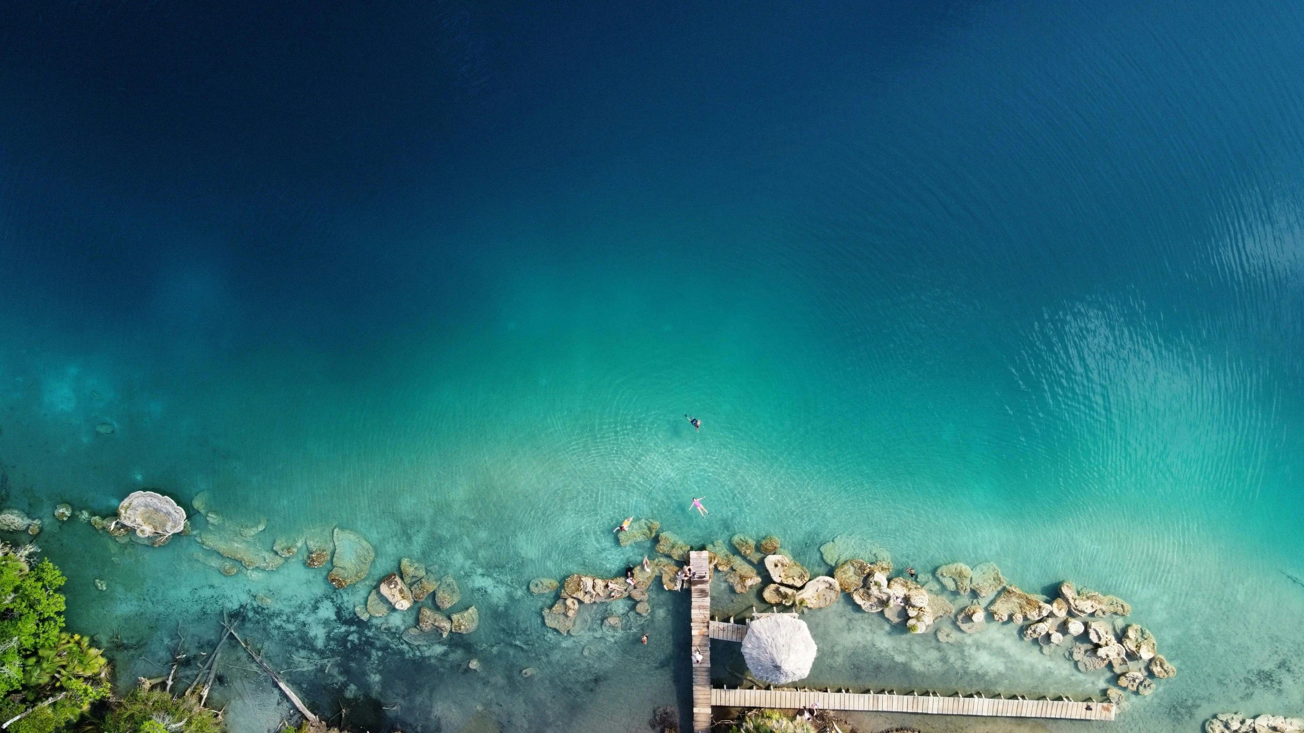 an aerial view of a dock in the water