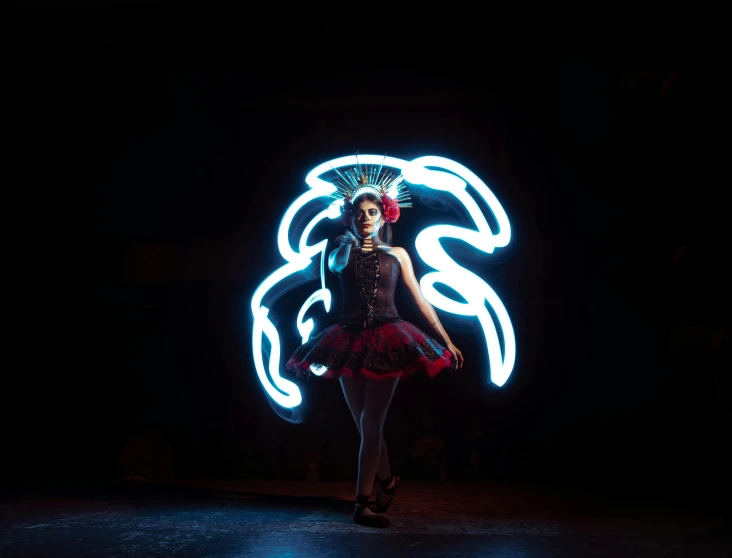 a woman that is standing up with a neon light