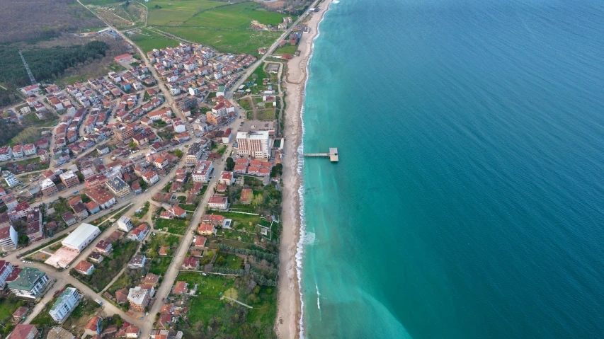 an aerial view of the beach and water