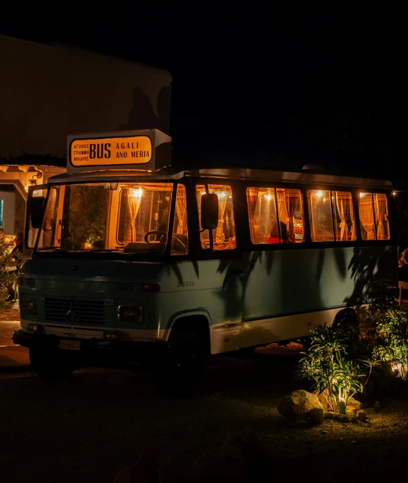 a bus with open windows in a building