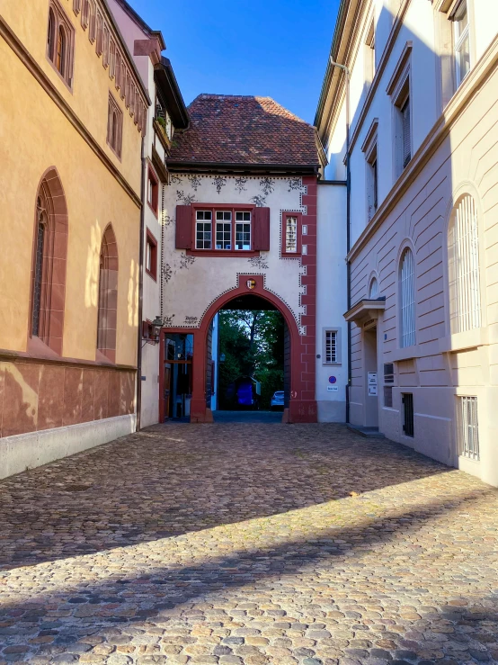 an old building is on the side of the road