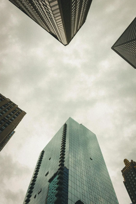 the looking up view from below of skyscrs