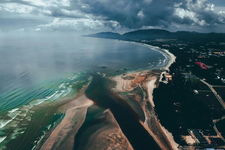 the aerial view from above looking down on a beach and coastline