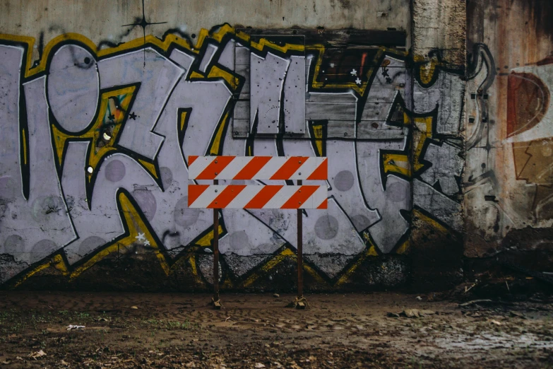 an area with some graffiti and barricades on it