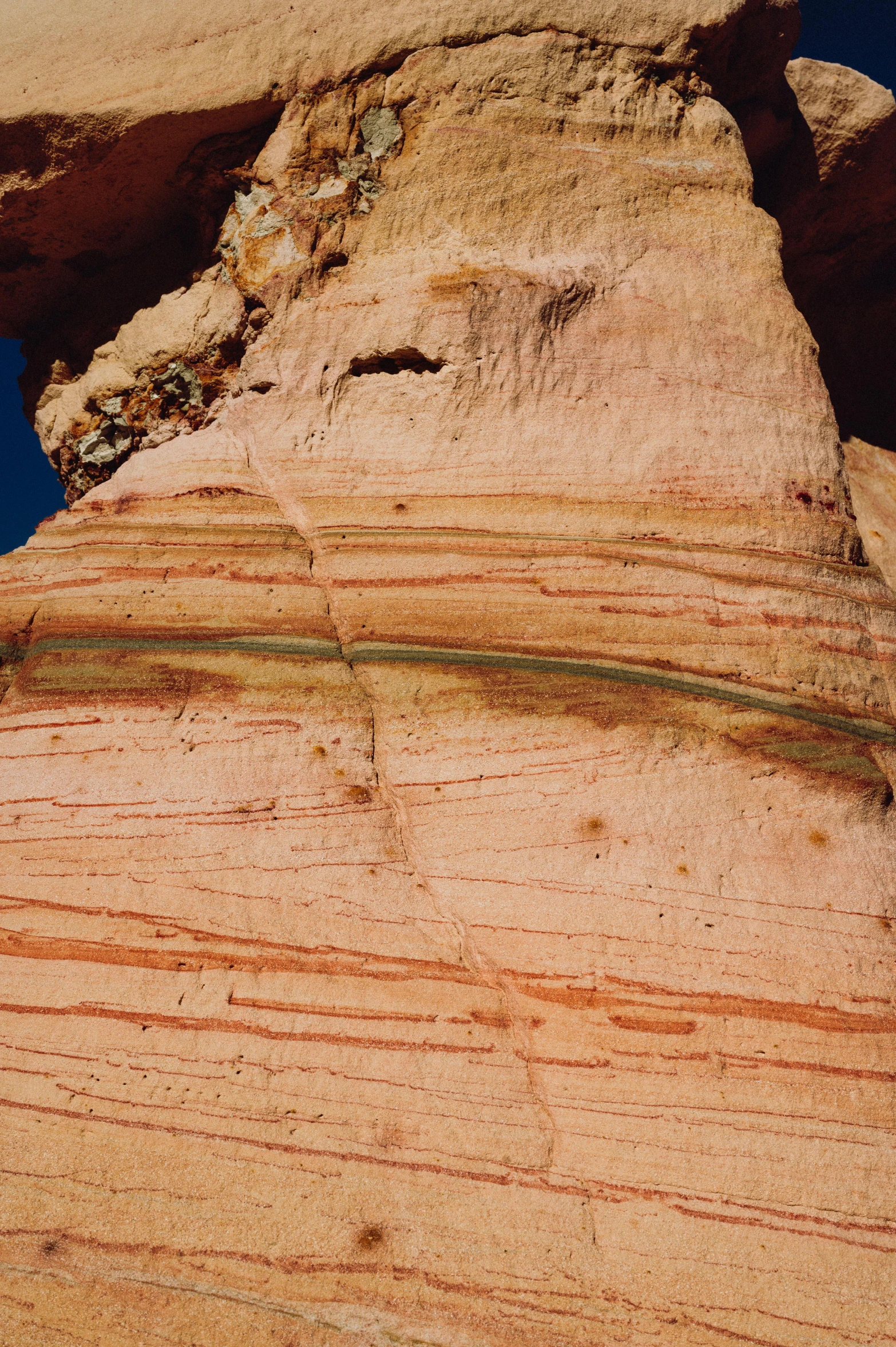 the edge of a rock with lines on it