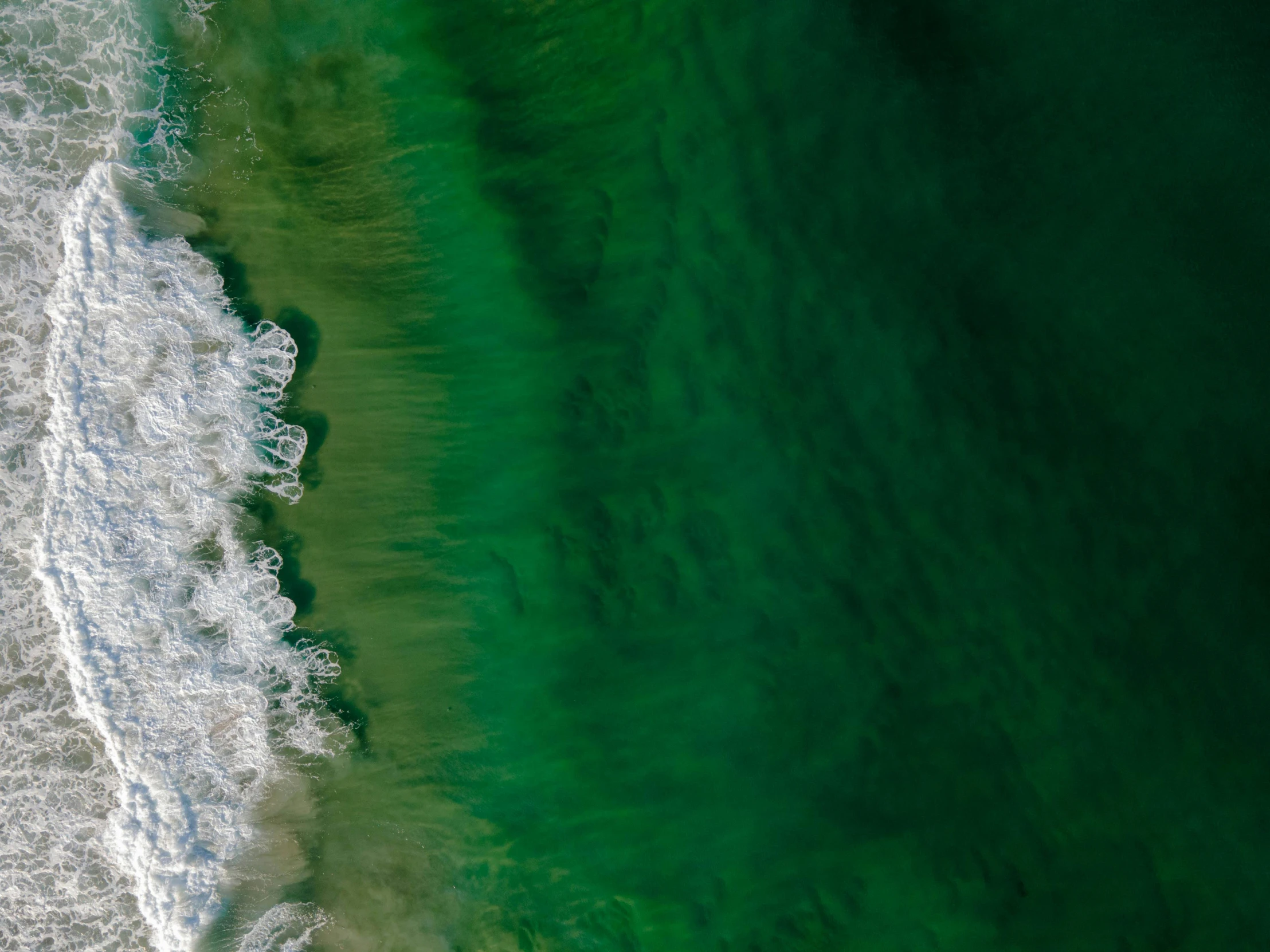 a view of the ocean from a very high above