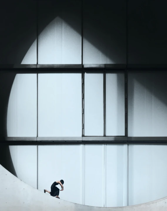 a person riding a skate board on a cement wall