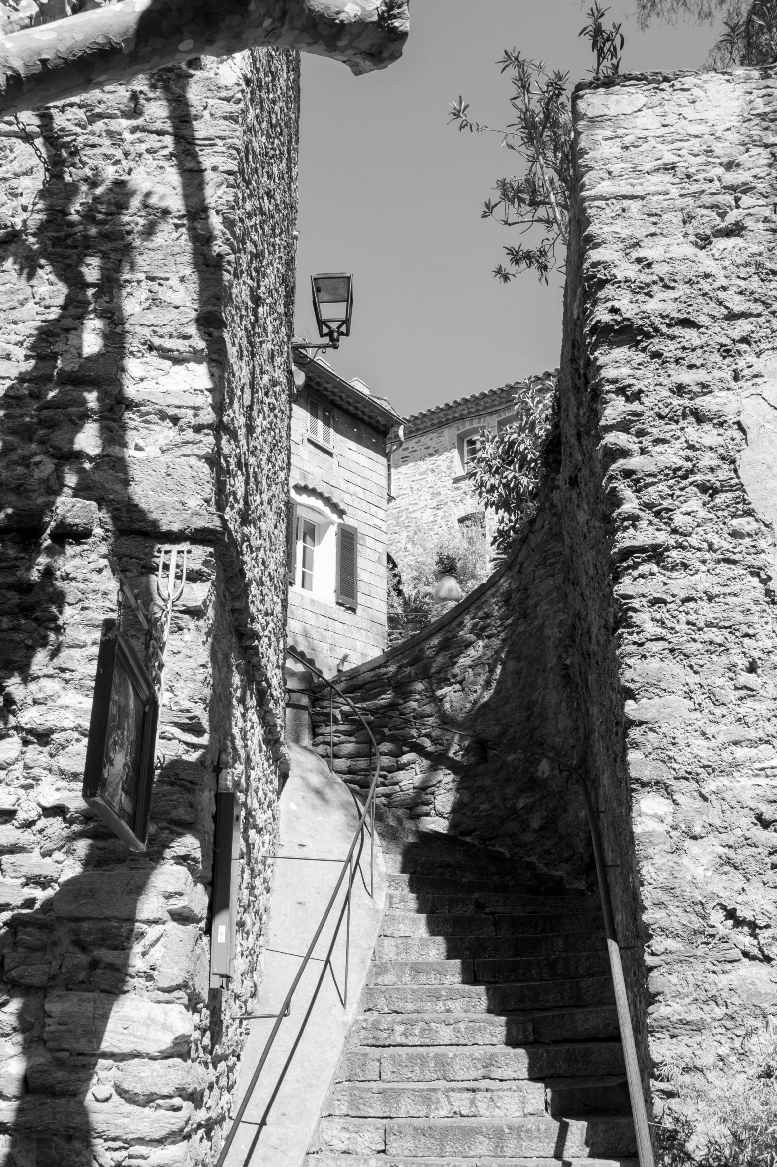 a stone stairway going up to an old building