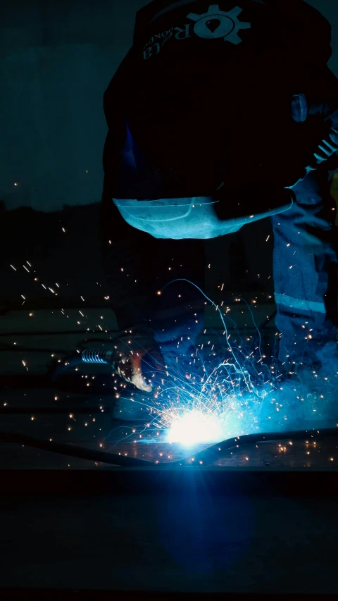 a welding with sparks inside his pants