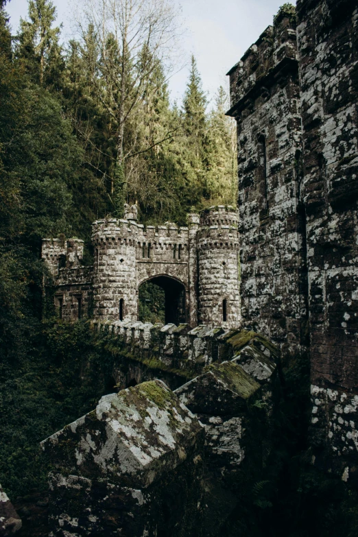 an old, stone building that is surrounded by trees