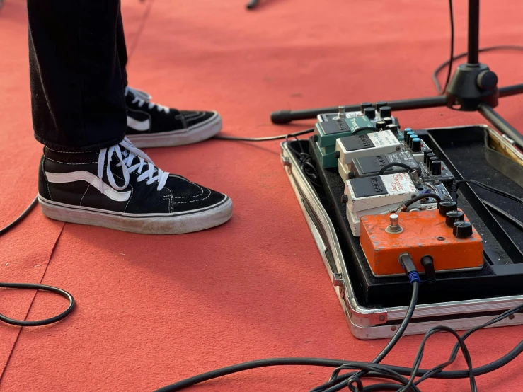 a music guitar is being tested on the floor