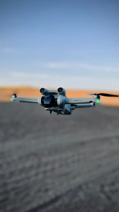 a large plane flying in the sky with propellers