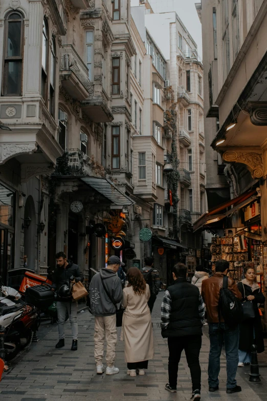 a city street with many people walking around