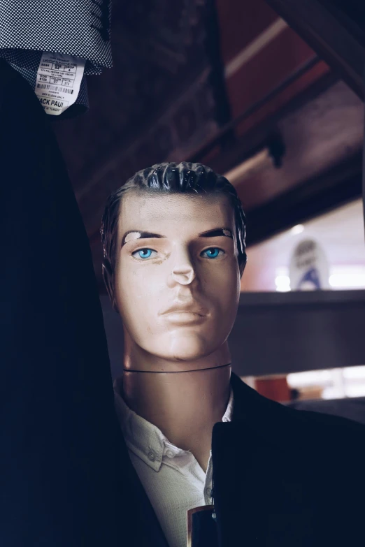 an empty male mannequin with a dress shirt and tie