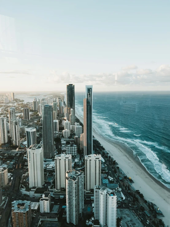 an aerial view of a beach next to the ocean