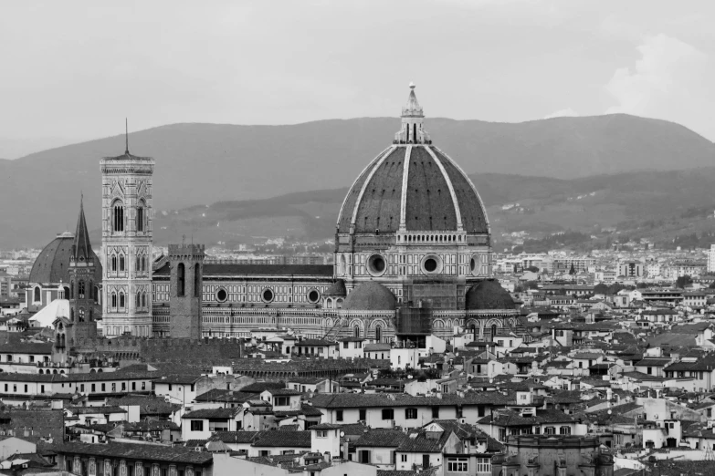 a city skyline that includes several buildings and a dome with a clock