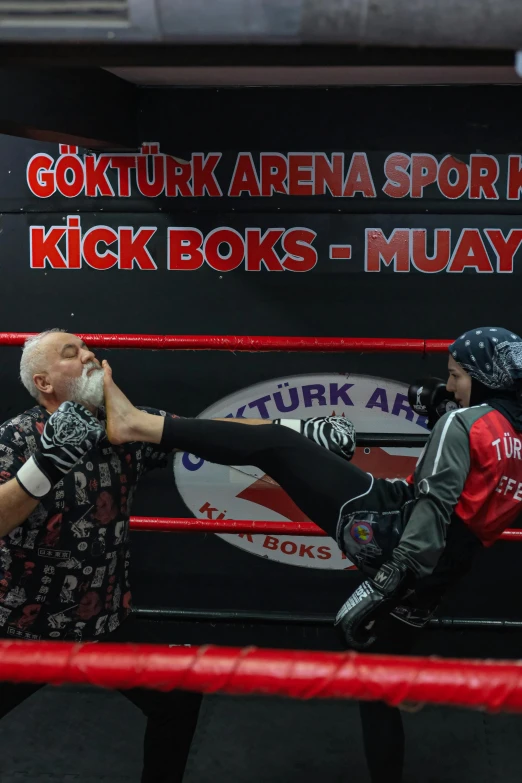 two men in masks stand next to an opponent