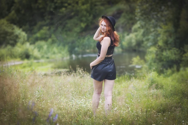 a woman in short dresses and hat looking at soing