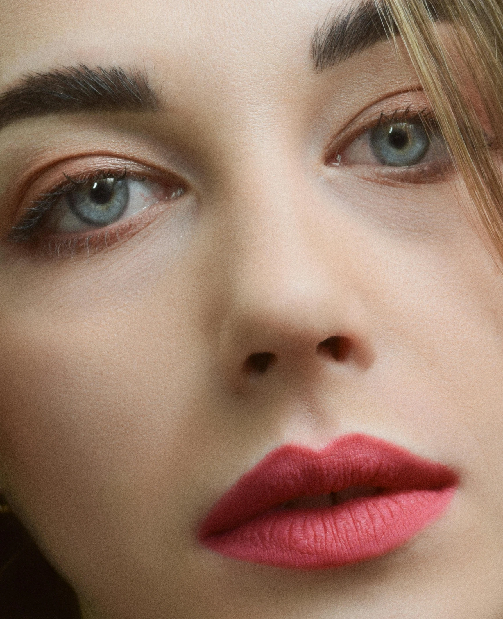 woman's eyes and makeup closeup, featuring long hair