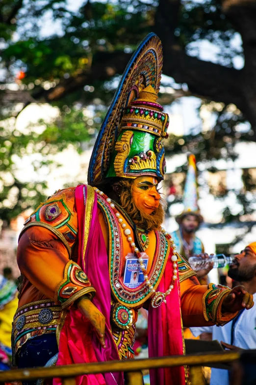 a man wearing a colorful mask on his head