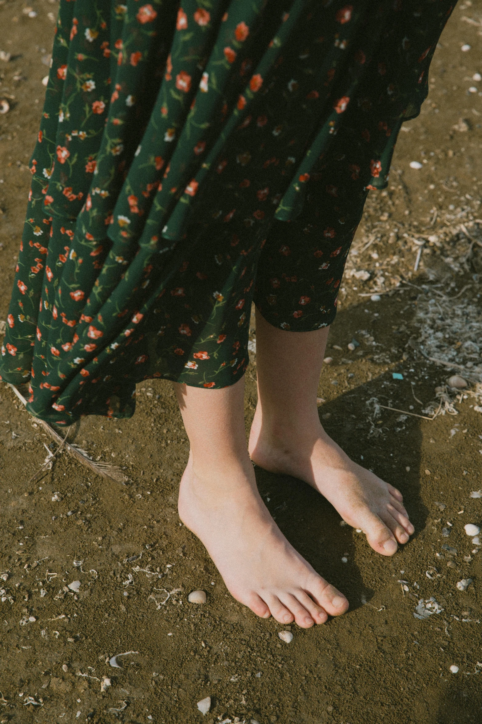 a closeup of a person wearing green pants