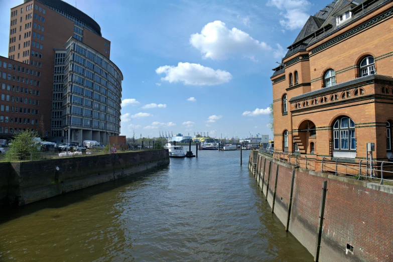 the view of a river and buildings with traffic passing through