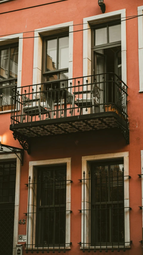 a bike is parked on a balcony above a building