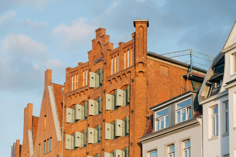 a brick building with several shutters on each side