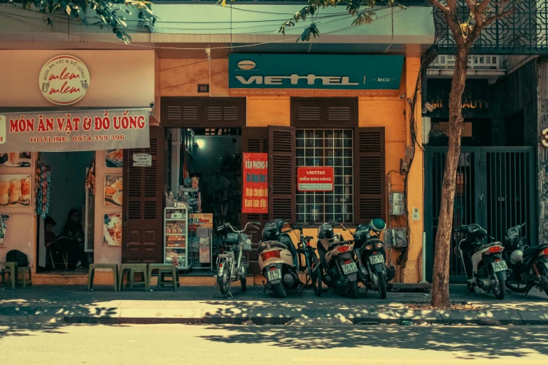 there is a number of motorcycles parked outside of a store