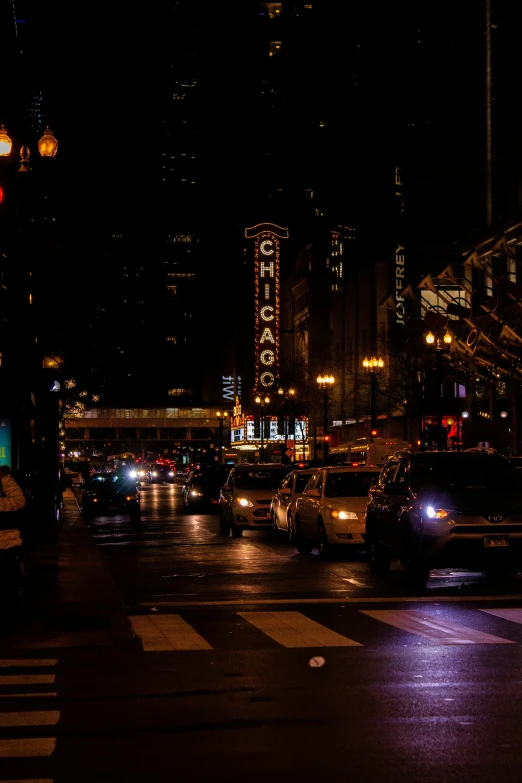 many cars are driving through the busy city streets