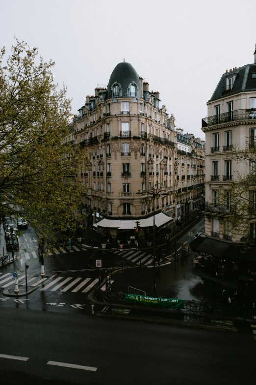 people on a rainy city street with a traffic light