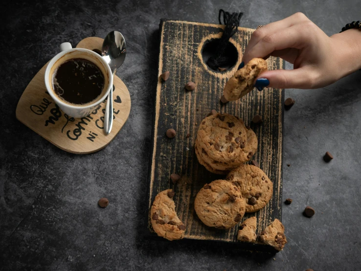 a tray with cookie cookies, chocolate and a cup of coffee