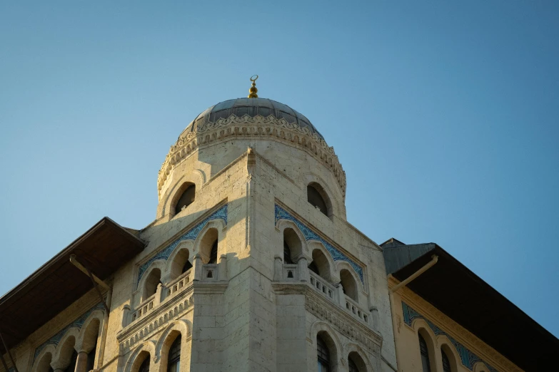 the top of a tall building with many windows