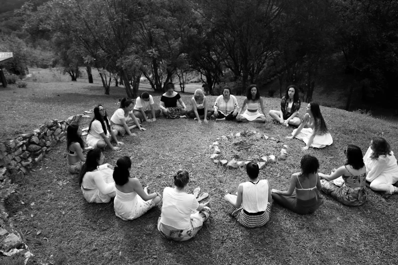 a group of s sitting in a circle