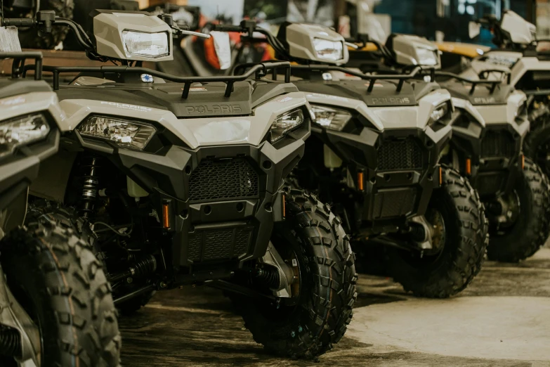 several four wheelers parked side by side outside
