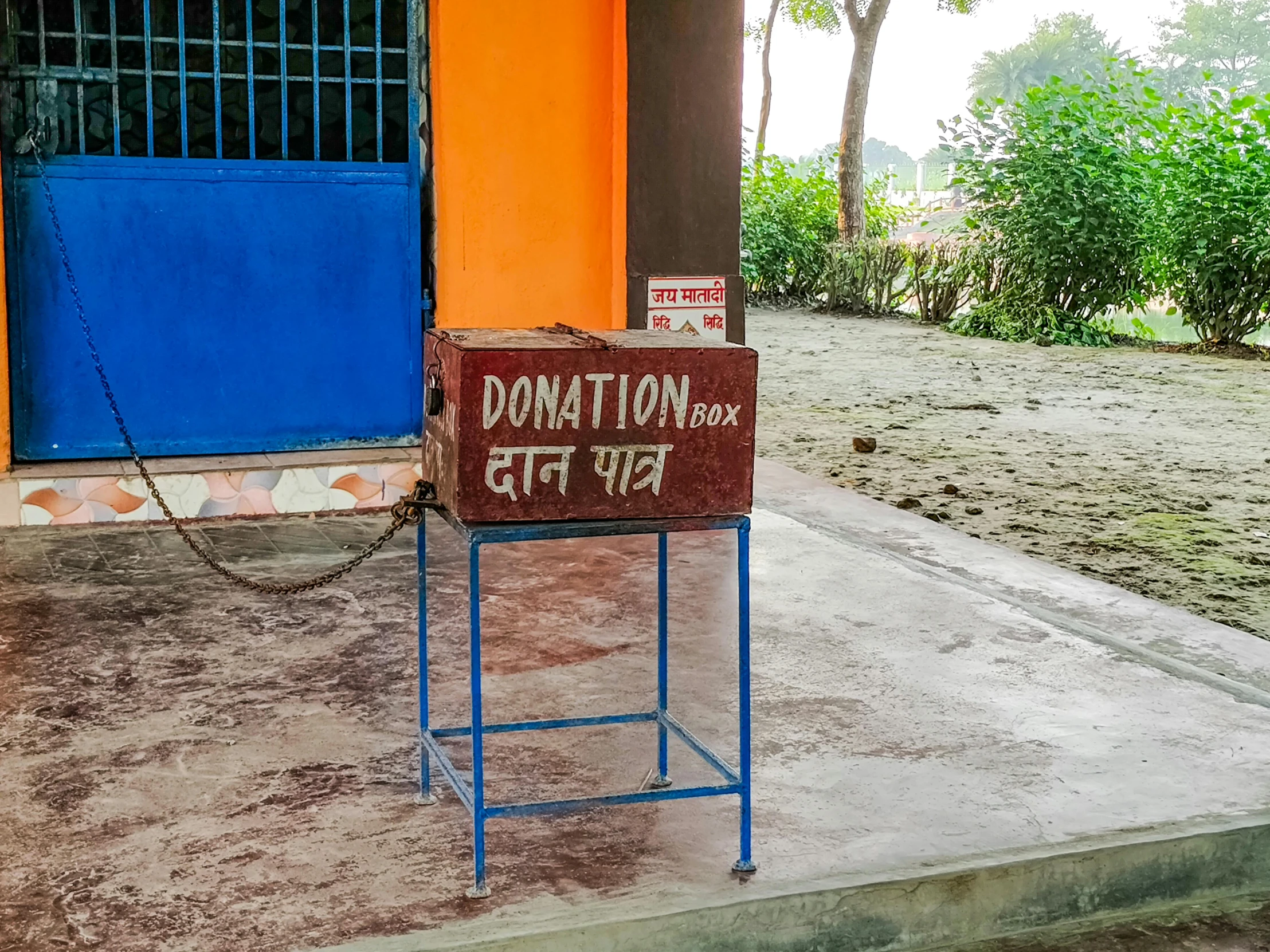 the sign is displayed on the front of a small building