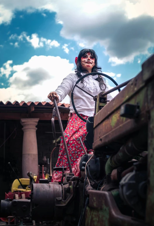 a woman is standing on the train while pulling a hose