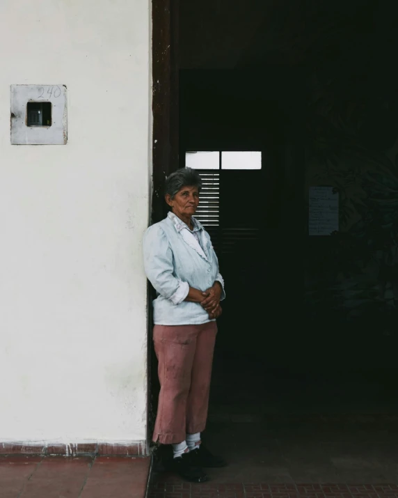 a woman standing in front of a door