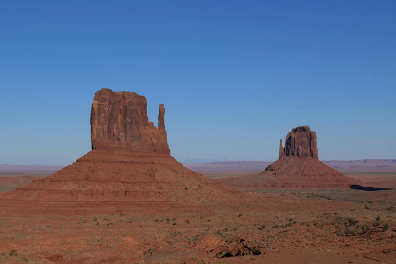 large red desert with very big rocks at the bottom