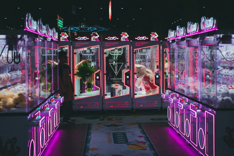 a large display of various toy machines at night