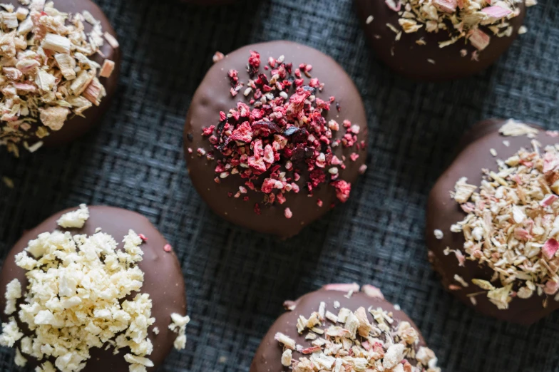 some chocolates have been sprinkled with red white and pink sprinkles