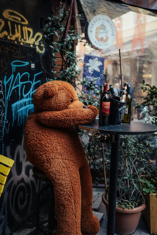 a teddy bear that is sitting at a table