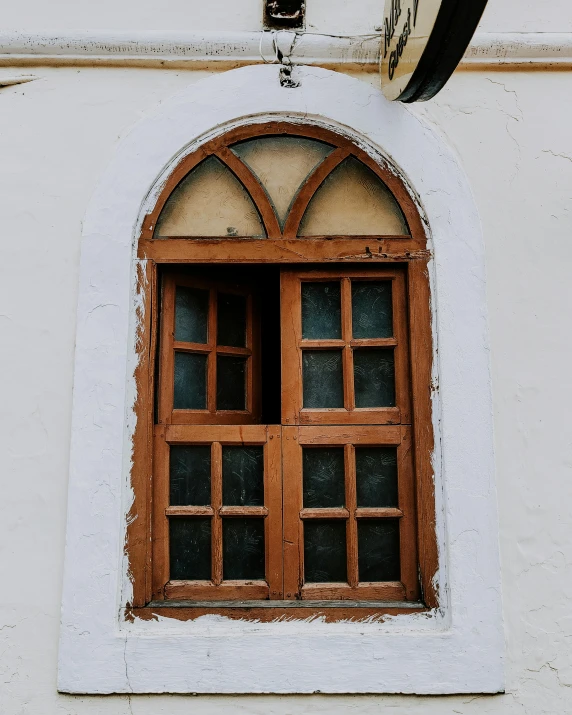 the front window of a building with many windows