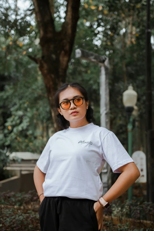 a woman in a white shirt and black shorts