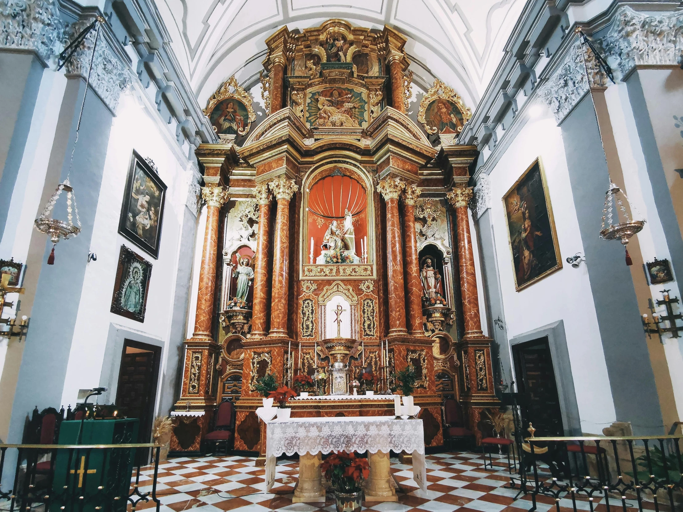 an inside view of a small church with pews and tables