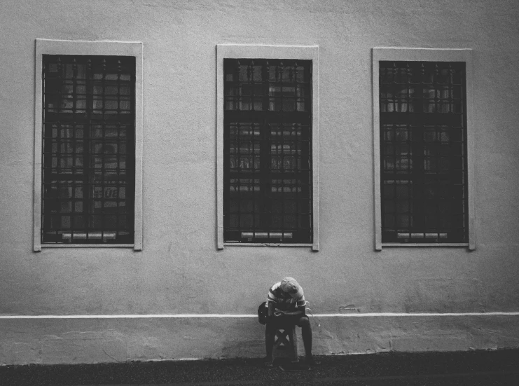 an image of a person sitting on the curb