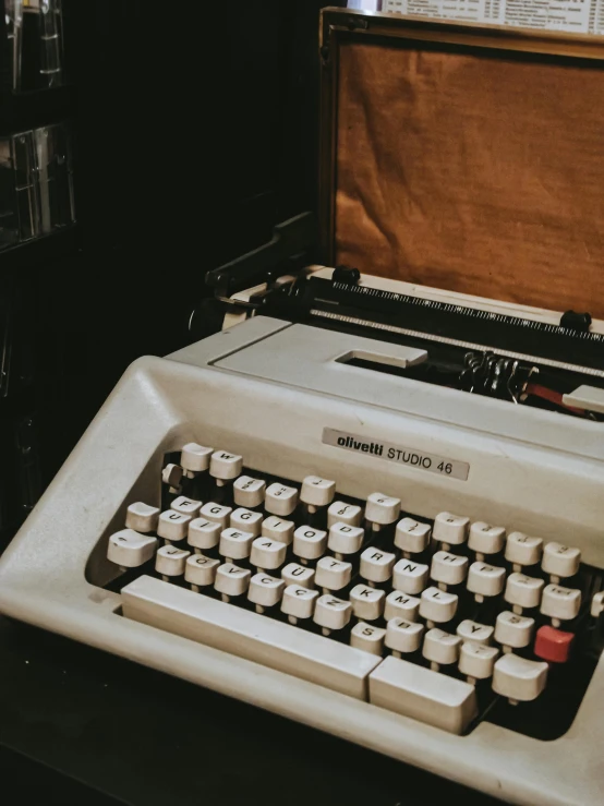a small old style typewriter sitting on a table